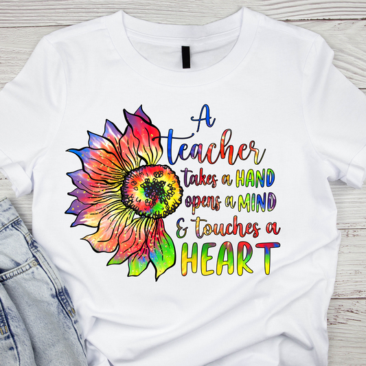 A teacher takes a hand opens a mind and touches a heart